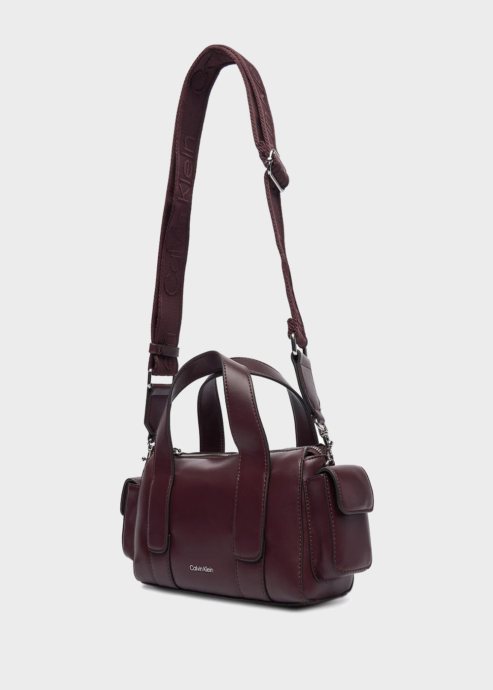 Handbag with shoulder strap and side pockets