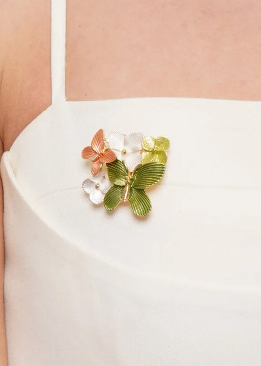 Spilla a calamita in metallo con fiori e farfalle