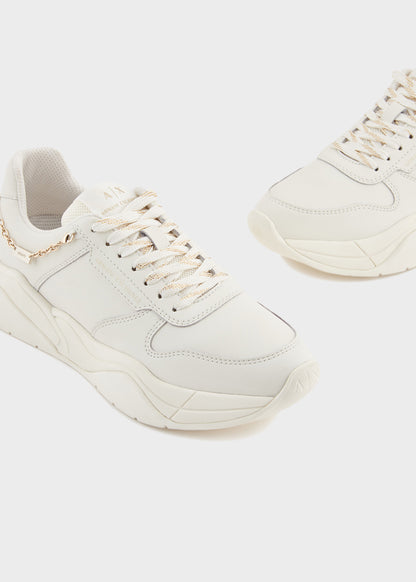 Sneakers con ciondolo