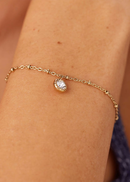 Bracciale Aurora in acciaio con finitura pvd oro 14K e cristallo pendente