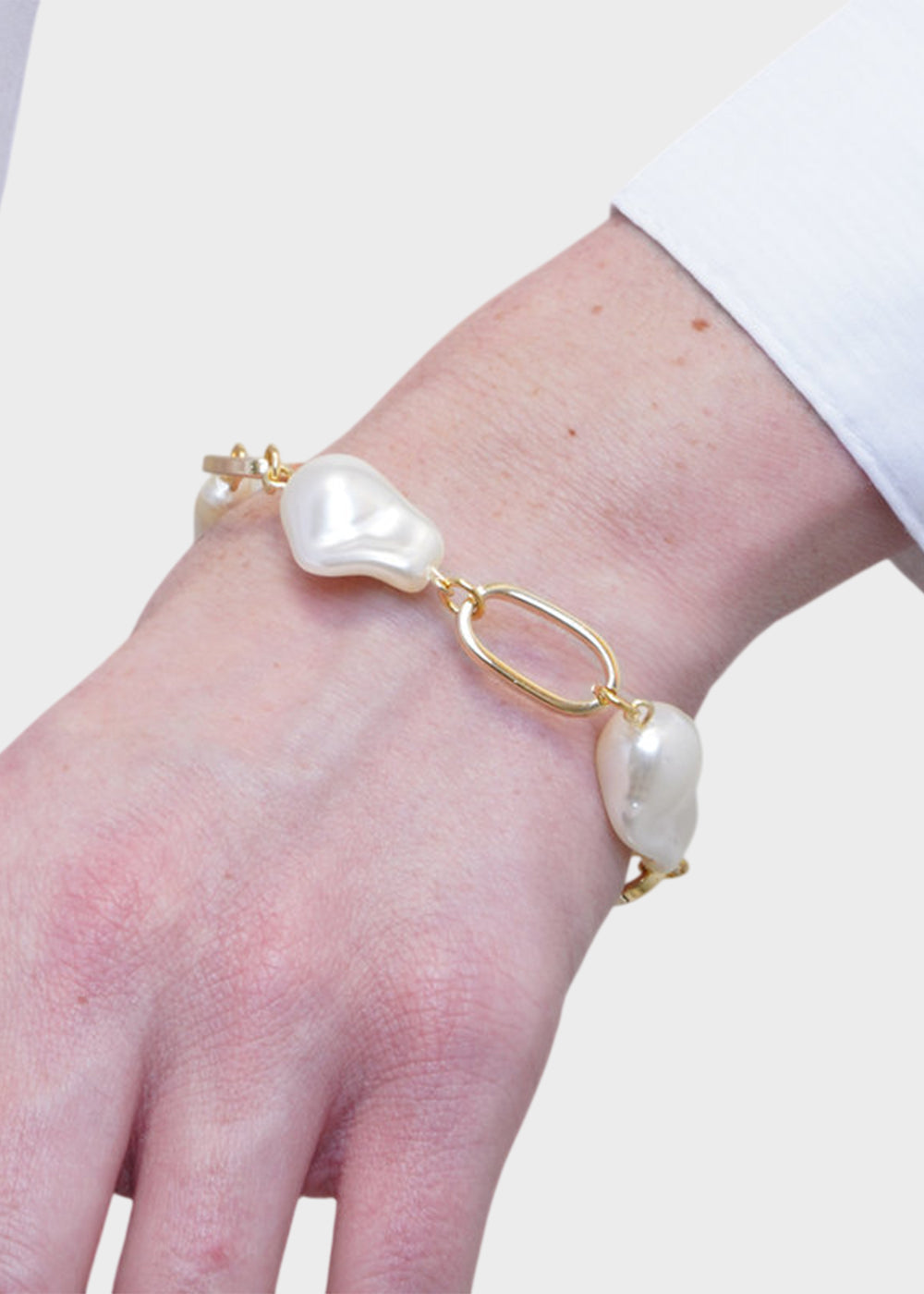 Bracciale in Metallo color oro con perle irregolari