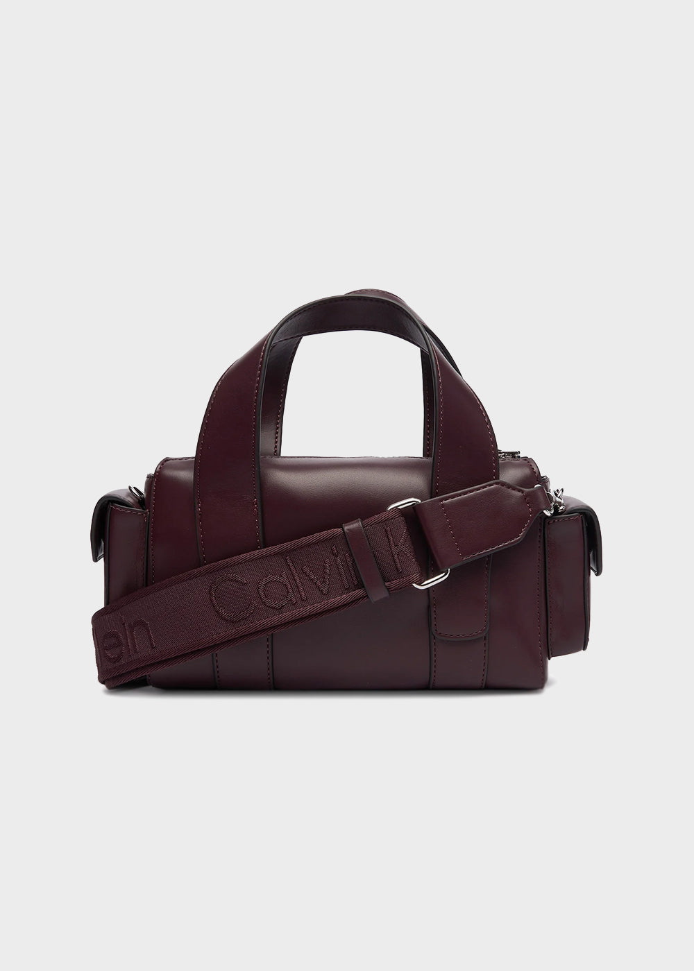 Handbag with shoulder strap and side pockets