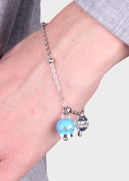 Bracciale in Acciaio color argento con campanella pendente azzurra con scritta Capri