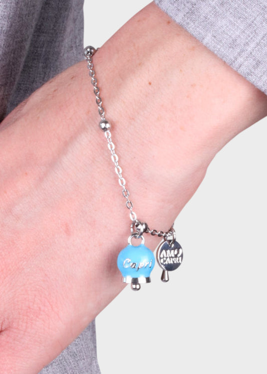 Bracciale in Acciaio color argento con campanella pendente azzurra con scritta Capri