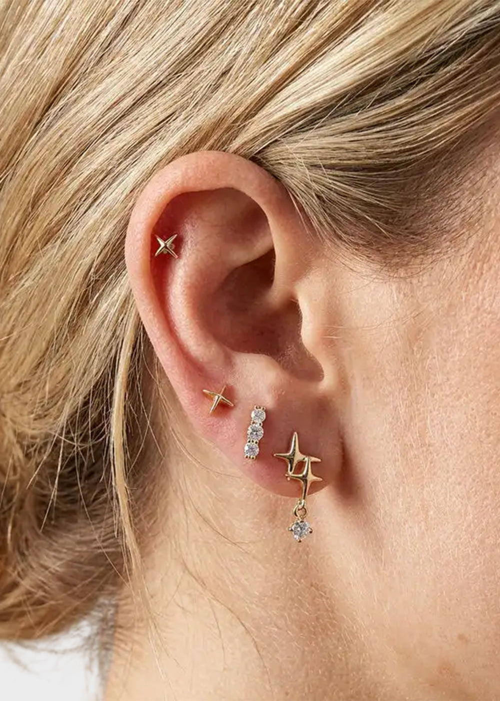 Orecchini in Metallo set da sei color oro con stelle e cristalli