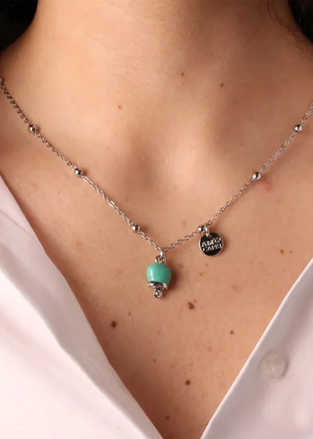 Collana in Metallo color argento con campanella turchese