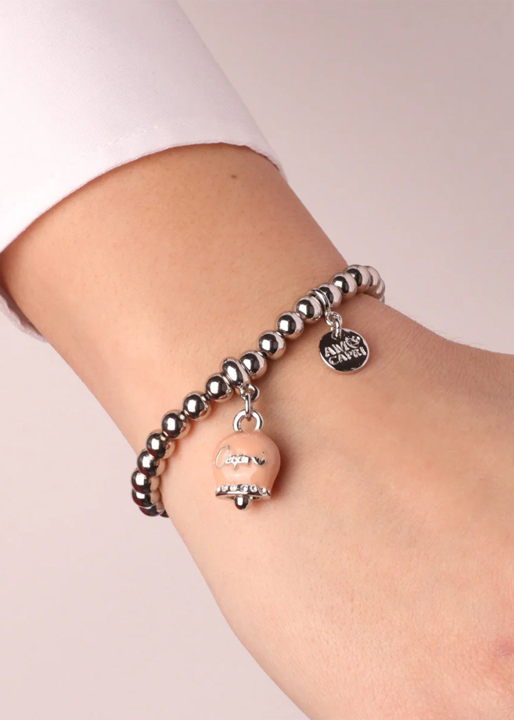 Bracciale in Metallo color argento con maglia a sfere e campanella Capri rosa antico