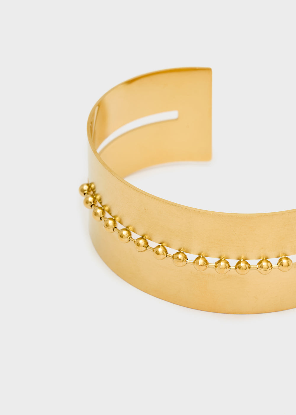Rigid bracelet with central detail