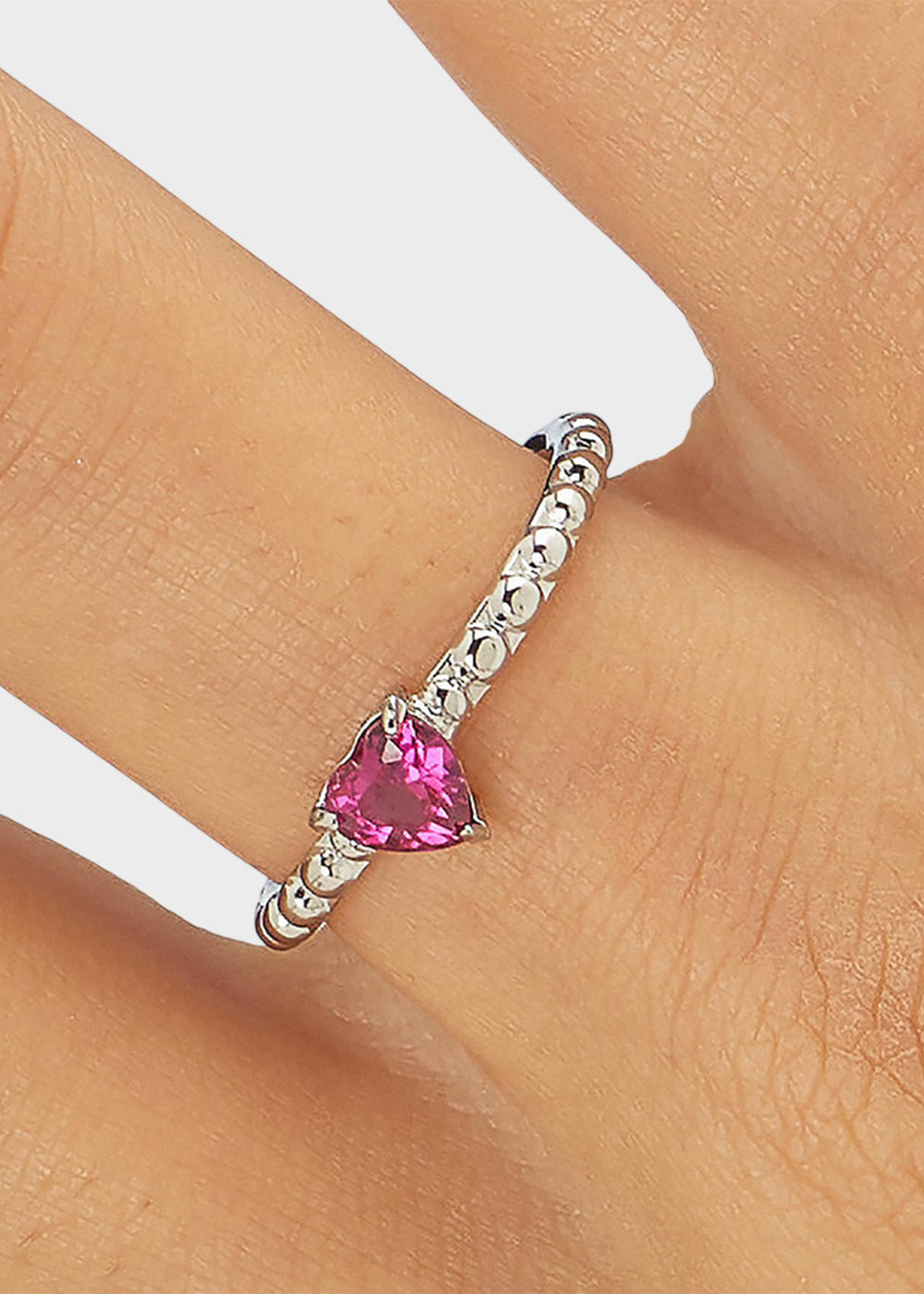 Anello regolabile Dazzly in acciaio con pietra a forma di cuore magenta
