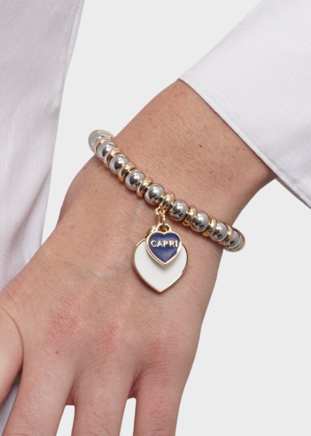 Bracciale in Metallo sfere color oro con cuore bianco Capri