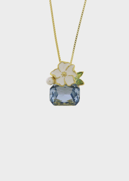Collana in Metallo color oro con fiore e pietre colorate