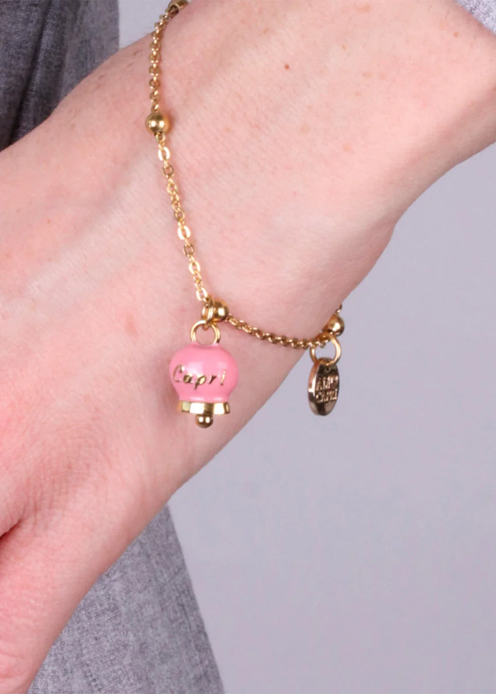 Bracciale in Acciaio color oro con campanella rosa Capri