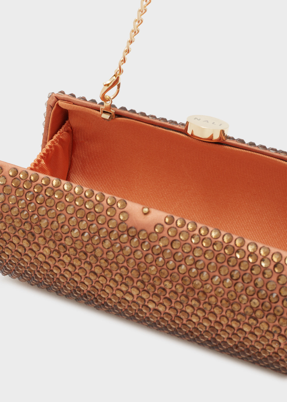 CLUTCH RUBINO CON PIETRE BRONZO