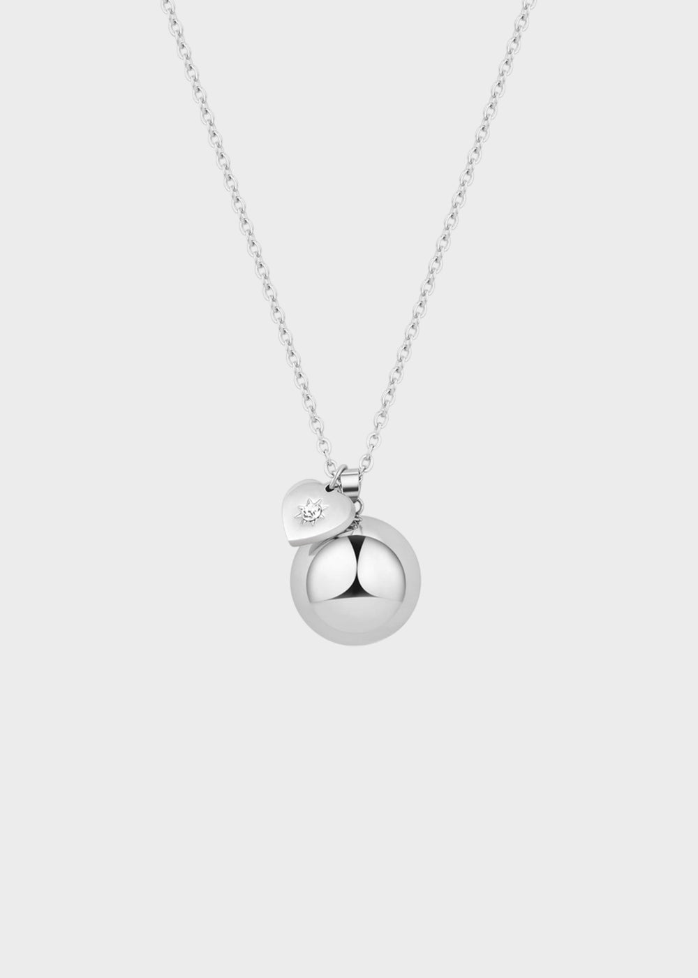 Collana lunga Whisper in acciaio con pendente chiama angeli e ciondolo a forma di cuore con cristallo