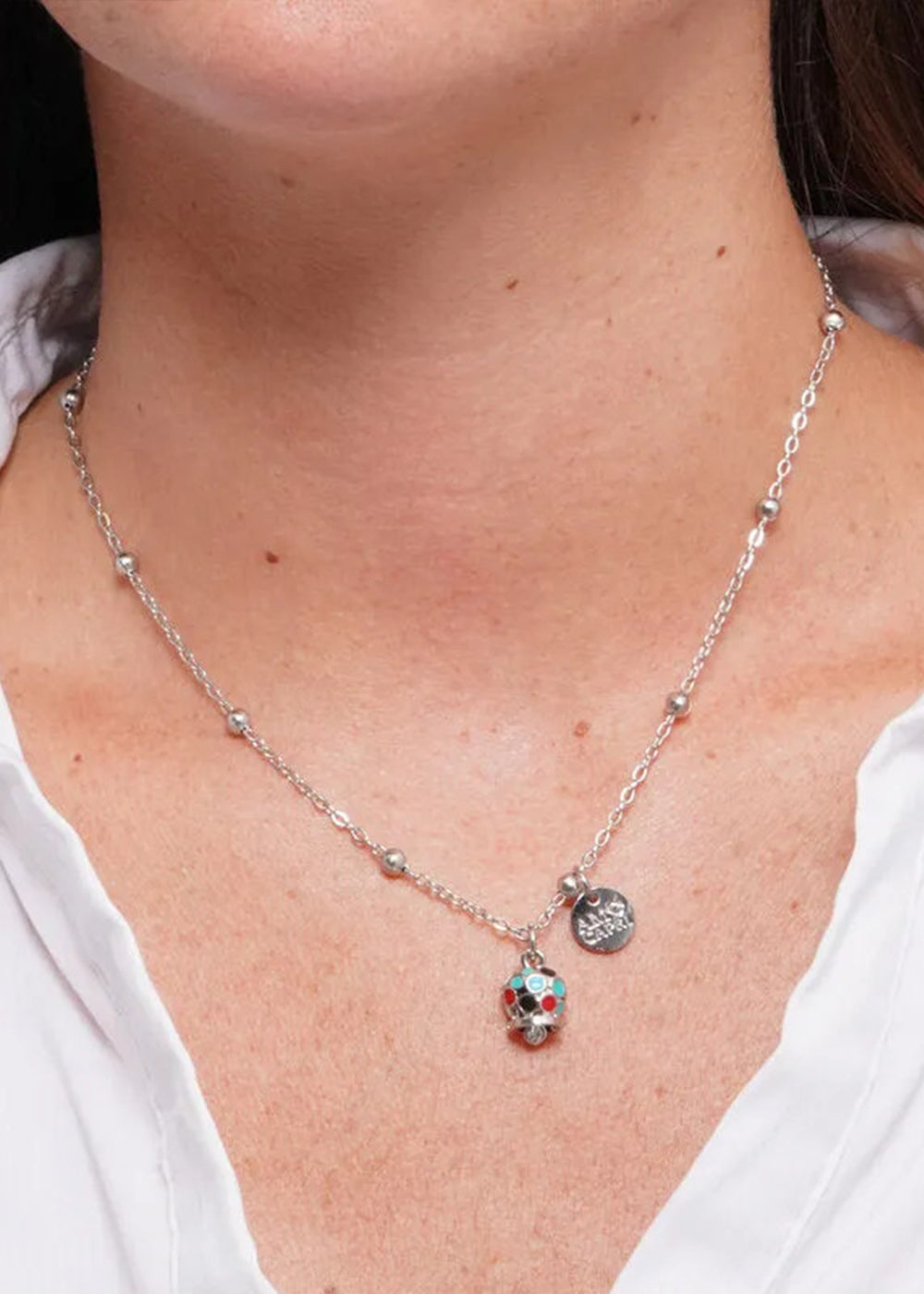 Collana in Acciaio color argento con campanella pendente impreziosita da smalti multicolore