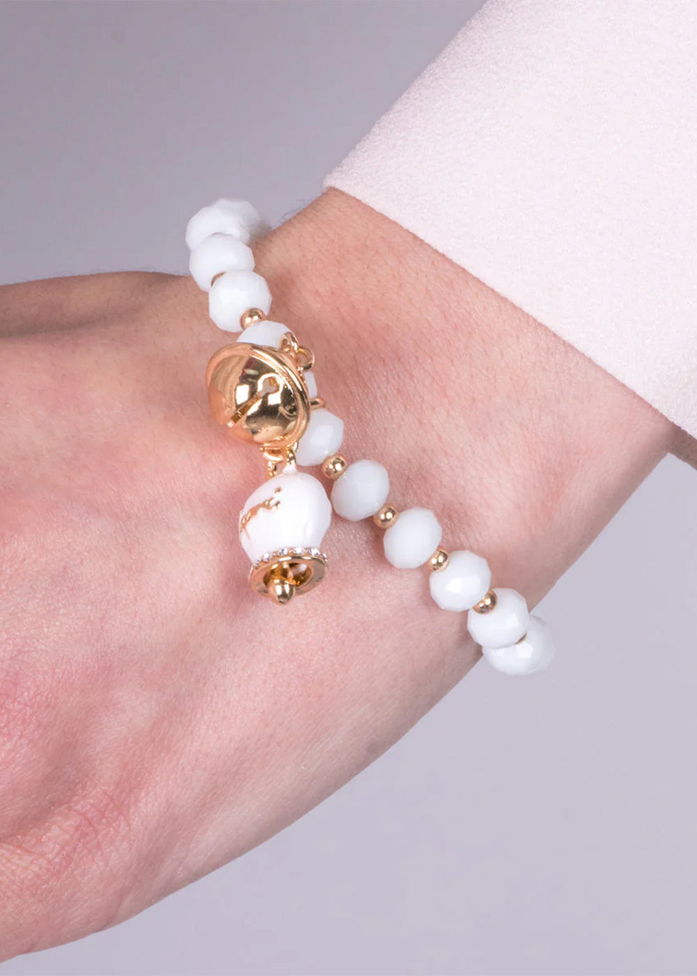 Bracciale in Metallo con campanella bianca e piccolo sonaglio con pietre bianche