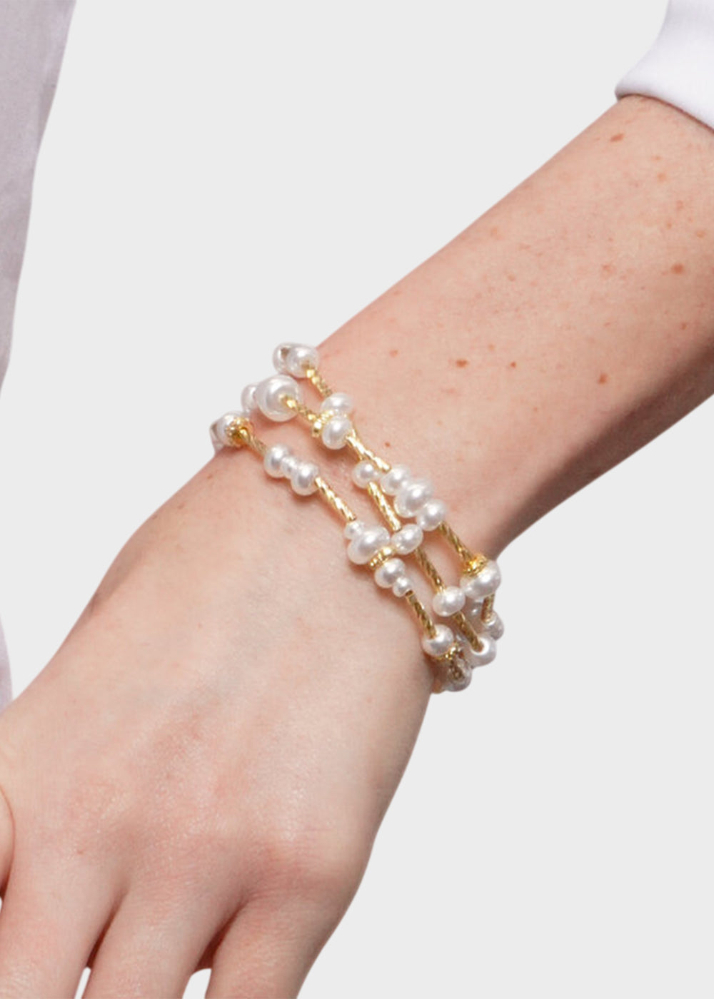 3 Bracciali elastici in Metallo color oro con perle